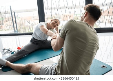 Young couple working out and practicing yoga in the comfort of their own home.	
 - Shutterstock ID 2366450415