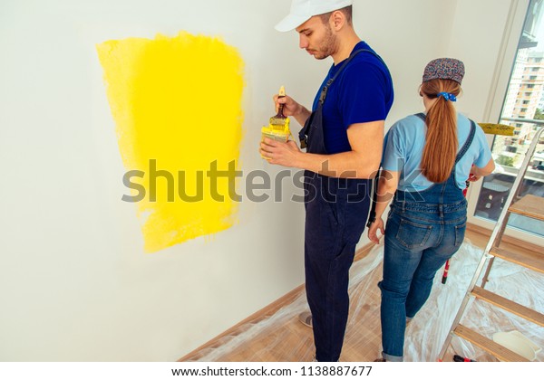 Young Couple Working Overalls Painting Wall Stock Image Download Now,Wall Paint Design Ideas With Tape For Boys