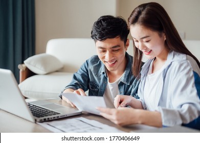 Young couple working together at home