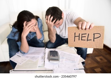 young couple worried need help in stress at home couch accounting debt bills bank papers expenses and payments feeling desperate in bad financial situation