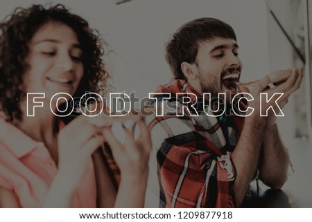 Young Couple Wrapped In Plaids. Food Truck Eating. Making An Order For Two. Young And Beautiful. Stylish Teenagers. Cold Day. Having Dinner Together. Pizza Time. Hungry Sweethearts.
