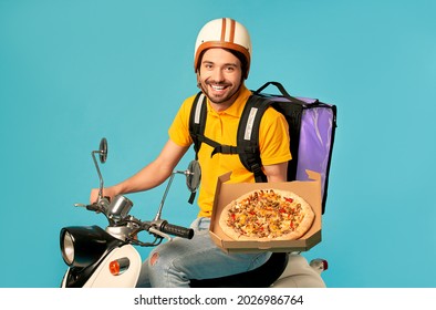 Young Courier, Pizza Delivery Man In Uniform With Thermo Backpack On A Moped Isolated On Blue Background. Fast Transport Express Home Delivery. Online Order.