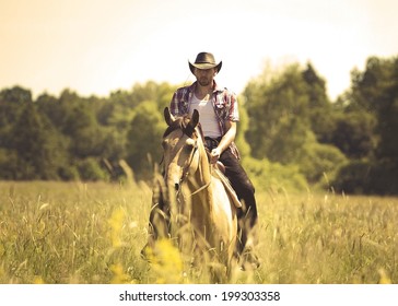 young cowboy man ridig with horse