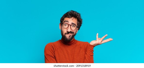 Young Crazy Bearded Man Confused Expression. Copy Space Concept