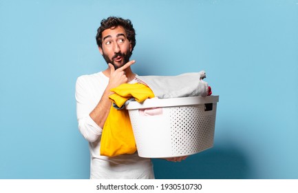 Young Crazy Bearded Man Housekeeping Washing Clothes