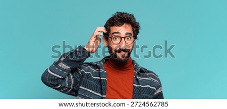 young crazy bearded man. thinking or doubting expression