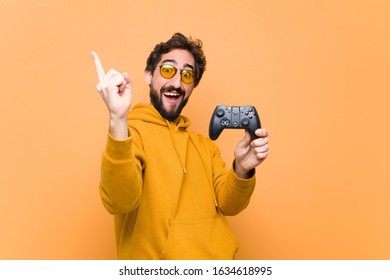 Young Crazy Cool Man Paying With A Game Console Controller