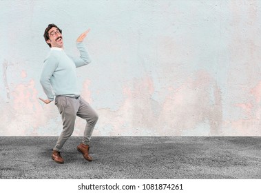 young crazy man dancing.full body cutout person against white background - Shutterstock ID 1081874261