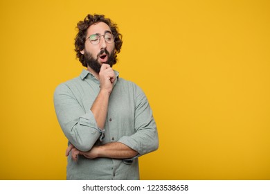 young crazy man with a dissenting, serious, stern expression, with thumbs down in disapproval. - Shutterstock ID 1223538658