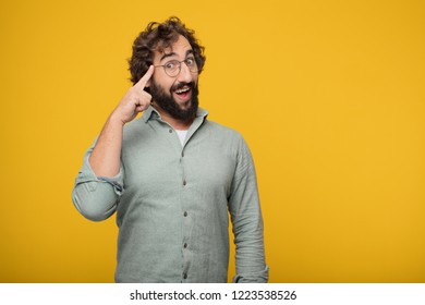 young crazy man looking happy and surprised, smiling and thinking of an amazing new idea or solution, excited with epiphany and sudden inspiration. - Shutterstock ID 1223538526
