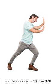 Young Crazy Man Pushing Or Holding Sign.full Body Cutout Person Against White Background