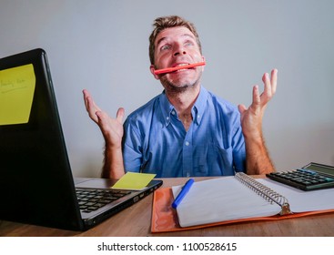 Young Crazy Stressed And Overwhelmed Man Working Messy At Office Desk Desperate With Laptop Computer Feeling Exhausted And Frustrated In Business And Work Problem Lifestyle Concept