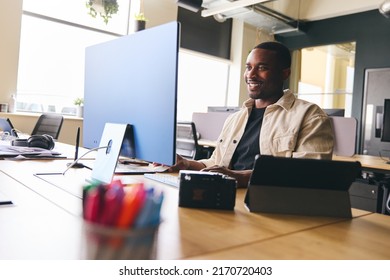 Young Creative Black Man Working On Computer In Modern Office At Desk Smiling