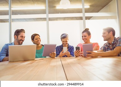 Young Creative Business People With Laptop And Digital Tablet In The Office