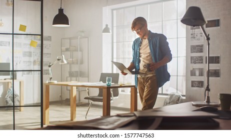 Young Creative Developer is Working in His Studio on a Laptop. Concept of Sucessful Designer working on Application Design, Software UI Development. In the Background Creative Modern Office - Powered by Shutterstock - Get 15% off with code: PIKWIZARD15