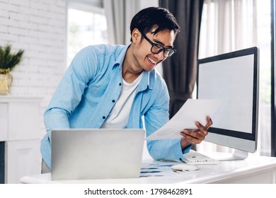 Young creative man relaxing using desktop computer working and video conference meeting online chat at home.work from home concept - Shutterstock ID 1798462891
