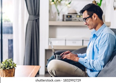 Young Creative Smiling Happy Asian Man Relaxing Using Desktop Computer Working And Video Conference Meeting Online Chat At Home.work From Home Concept