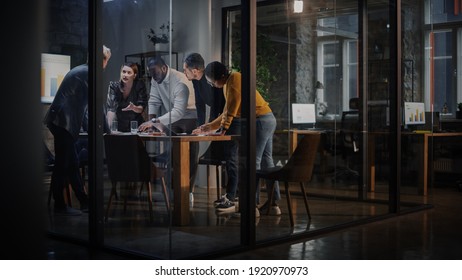 Young Creative Team Meeting with Business Partners in Conference Room Behind Glass Walls in Agency. Colleagues Sit Behind Conference Table and Discuss Business Opportunities, Growth and Development. - Shutterstock ID 1920970973