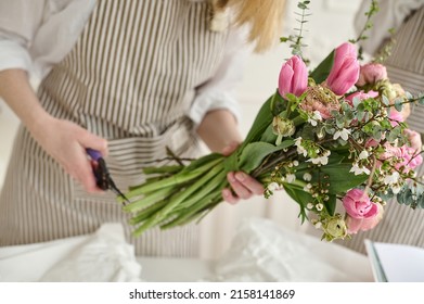 Young creative woman in a flower shop, using laptop. A startup of florist business. - Shutterstock ID 2158141869
