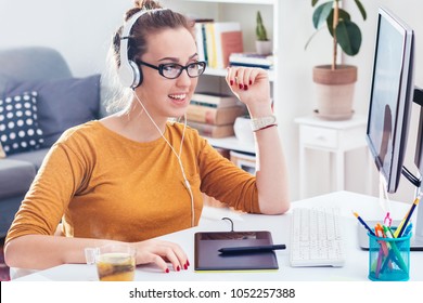 Young  Creative Woman Working On A Computer, Home Office. Smilling, Wearing Headset. Web Designer,  Freelance On Remote