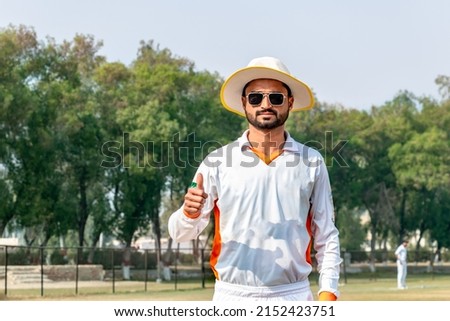 young cricketer on match ground