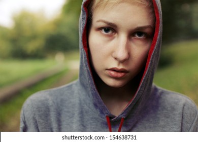 Young criminal said teenager posing outdoor on the street. 