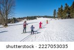 Young cross country skiers. Family trip on sunny winter day. Kralovka, Jizera Mountains, Czech Republic