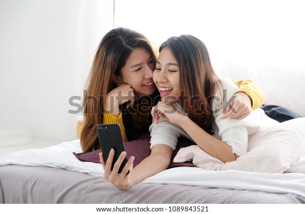 Cute young lesbians with toys