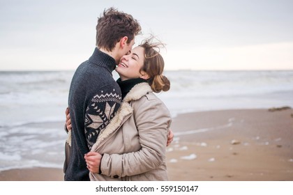  Young Cute Couple At Sea In Winter	