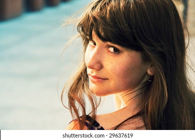 Young Cute Girl Looking Back Over Her Shoulder