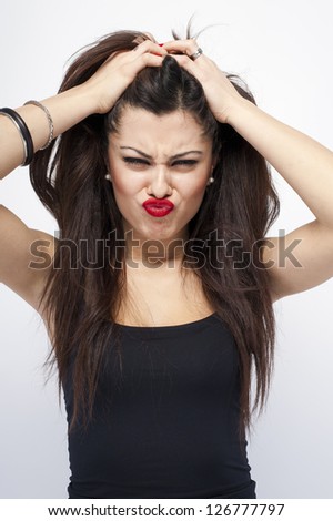 Young cute woman crazy funny expression on white background