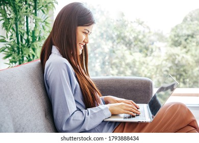 Young Cute Woman feels happy while video call Meeting on Work For Home Period. COVID-19 Lock Down.  Copy Space and Warm Tone. - Shutterstock ID 1793888434