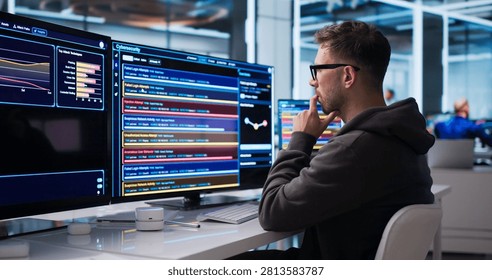 Young Cybersecurity Analyst Monitors Network Threats In Real-time Using Advanced Software Tools.