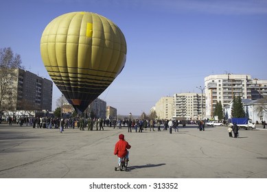 young cyclist and balloon