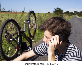 young cyclist calling for help on the road