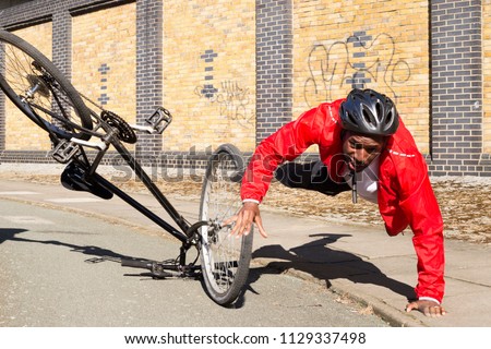 young cyclist having an accident on his bike