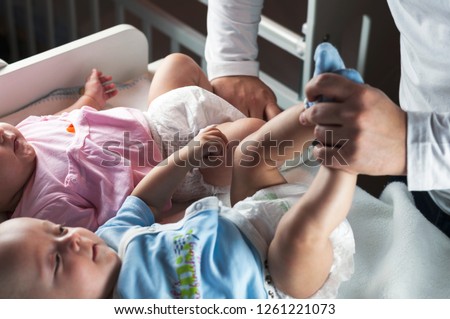 Similar – Relaxed mother and sons playing over the bed