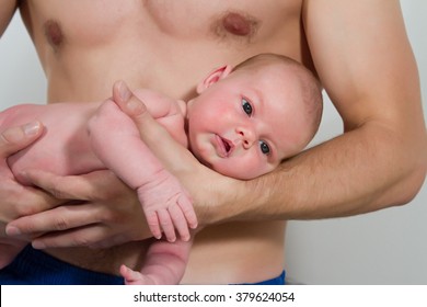 Young Dad Holding Newborn Baby