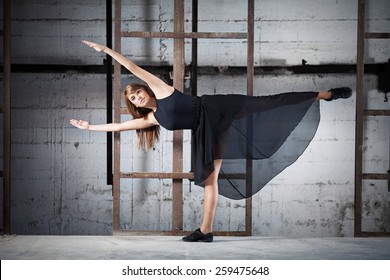 Young Dancer Taking A Modern Dance Performance In An Urban Industrial Surrounding
