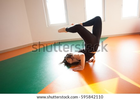 Similar – Image, Stock Photo Woman stretching on yoga mat in a yoga studio