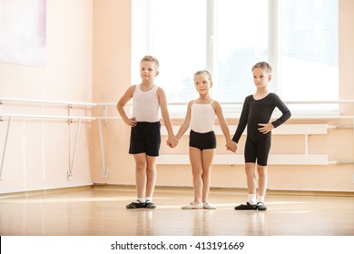 Young dancers warming up at ballet class