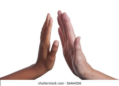 Young dark skinned mixed race girls hand, giving a High Five to an  older fair skinned senior woman's hand. Isolated on white background including clipping path.