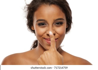 Young Dark Skinned Woman Touching Her Nose