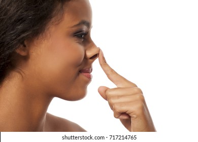 Young Dark Skinned Woman Touching Her Nose