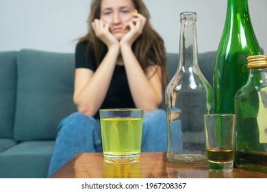 Young Dark-haired Woman With A Hangover Will Drink A Fizzy Pill From Her Head After A Wild Party At Home, Trying To Prepare For The Day Ahead. Concept Of Monday Morning, Morning After Drinking Alcohol