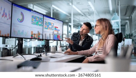 Young Data Analyst Predicts High Performance Using KPI Dashboard Chart.