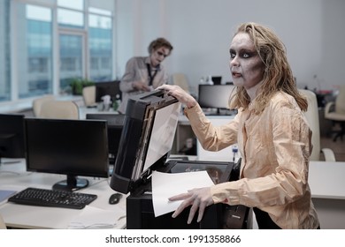 Young Dead Female Making Paper Copies By Xerox Machine