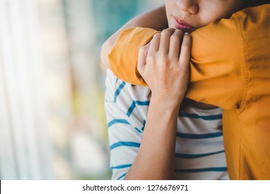 Young Depressed Asian Woman Hug Her Friend For Encouragement, Selective Focus, PTSD Mental Health Concept.