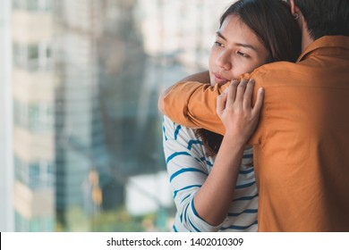Young depressed asian woman hug her friend for encouragement, Selective focus, PTSD Mental health concept.