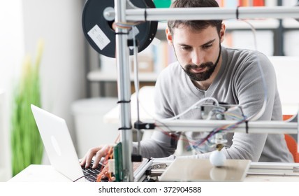 Young Designer Engineer Using A 3D Printer In The Laboratory And Studying A Product Prototype, Technology And Innovation Concept